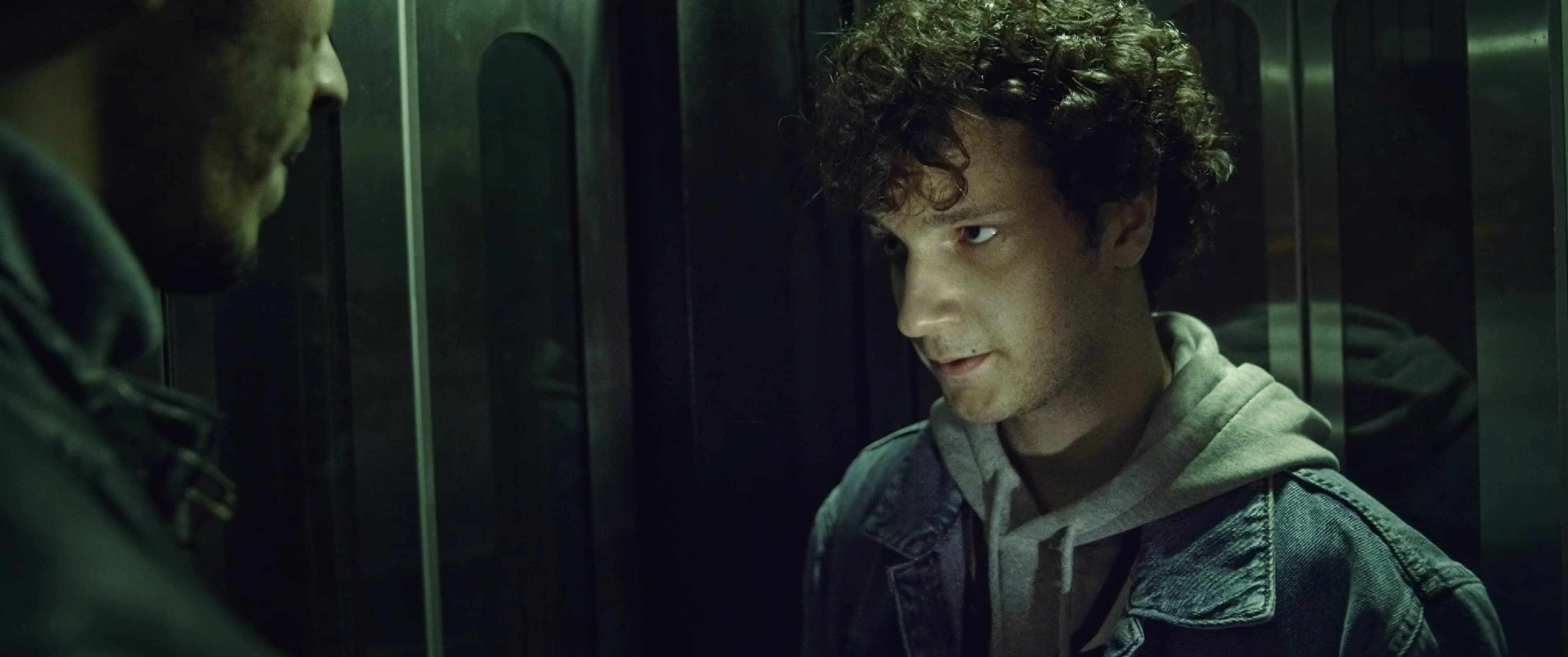 Birthday — the curly-haired young man in close-up